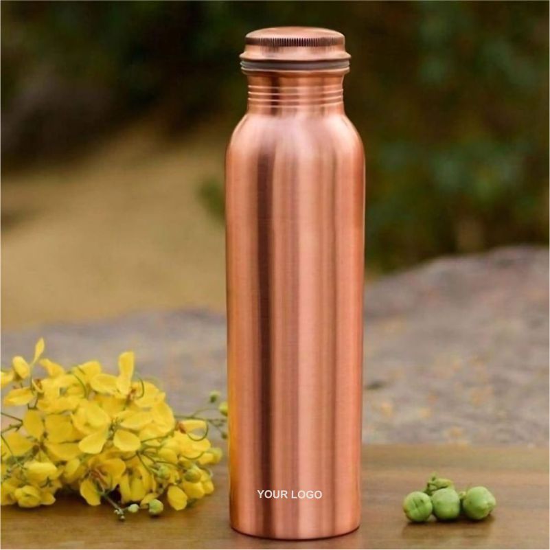 Copper reusable water bottle with a “Your Logo” label placed on a wooden surface with yellow flowers.